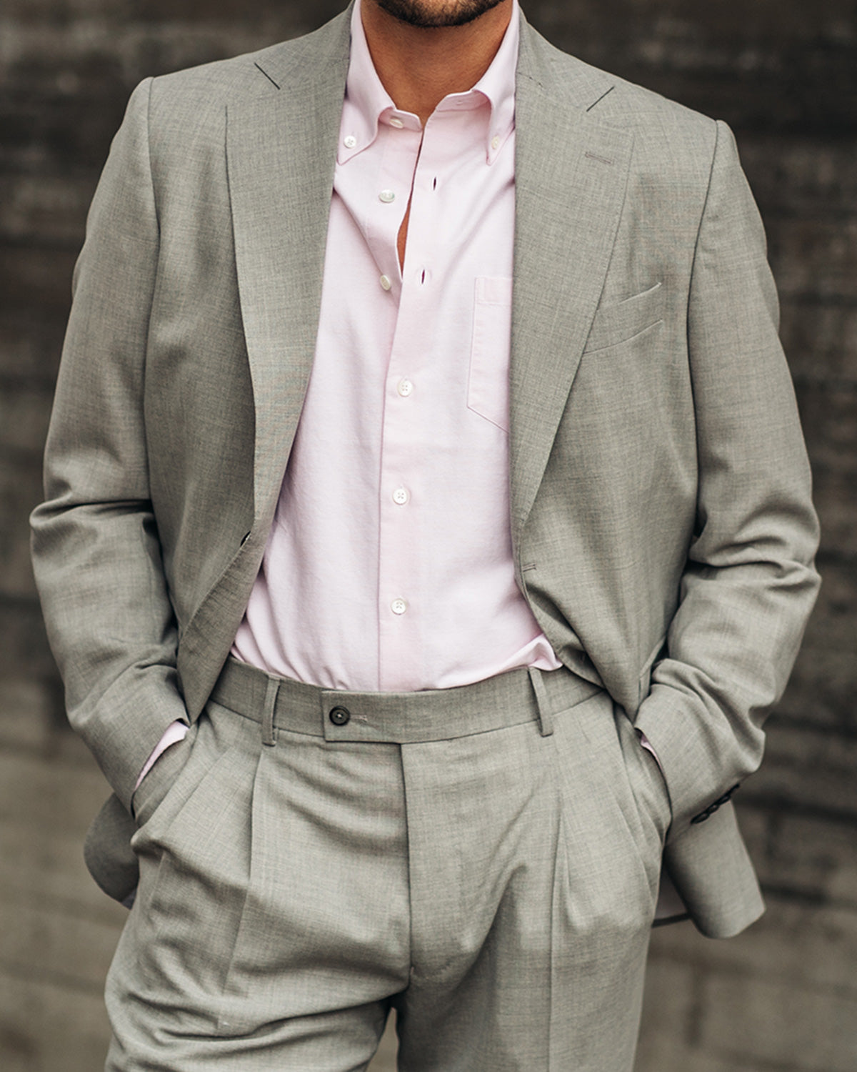 Man Wearing Pink Oxford Shirt Under Light Grey Wool Suit