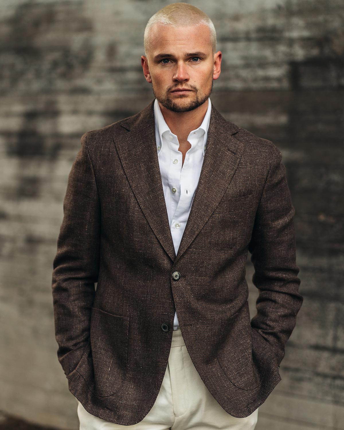 Man wearing brown blazer and a white shirt