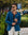 Man wearing a blue blazer and sunglasses outdoors