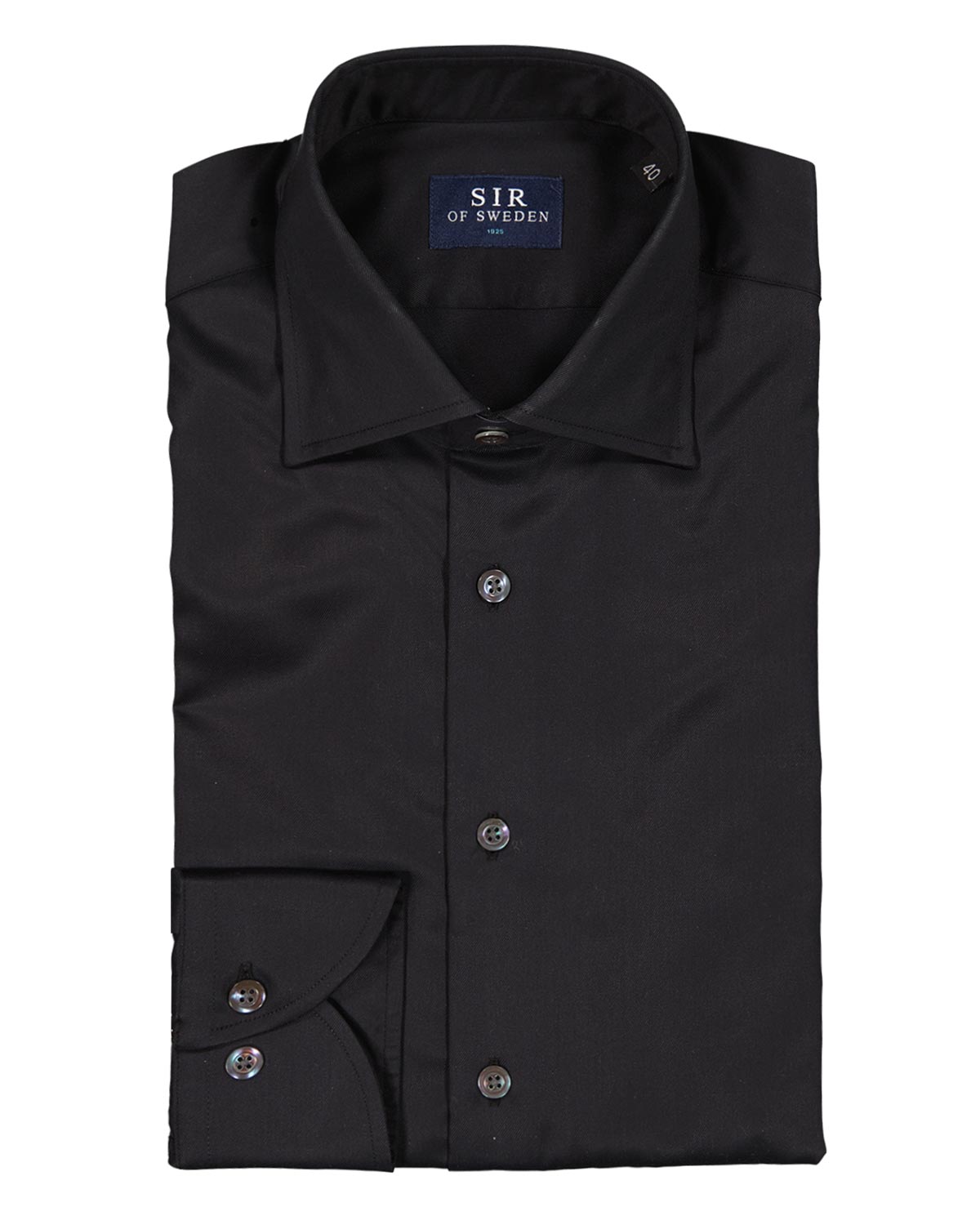Folded black dress shirt with visible brand label on a white background