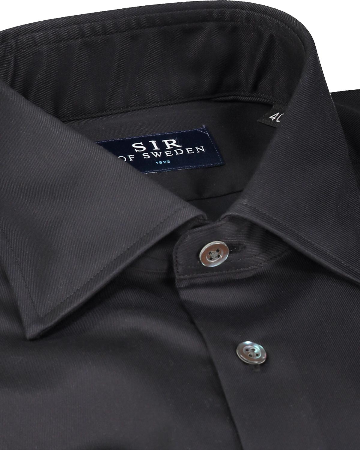 Close-up of a black shirt collar with 'SIR of Sweden' label