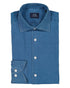 Folded blue denim shirt with 'SIR of Sweden' label on a white background