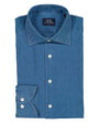 Folded blue denim shirt with 'SIR of Sweden' label on a white background