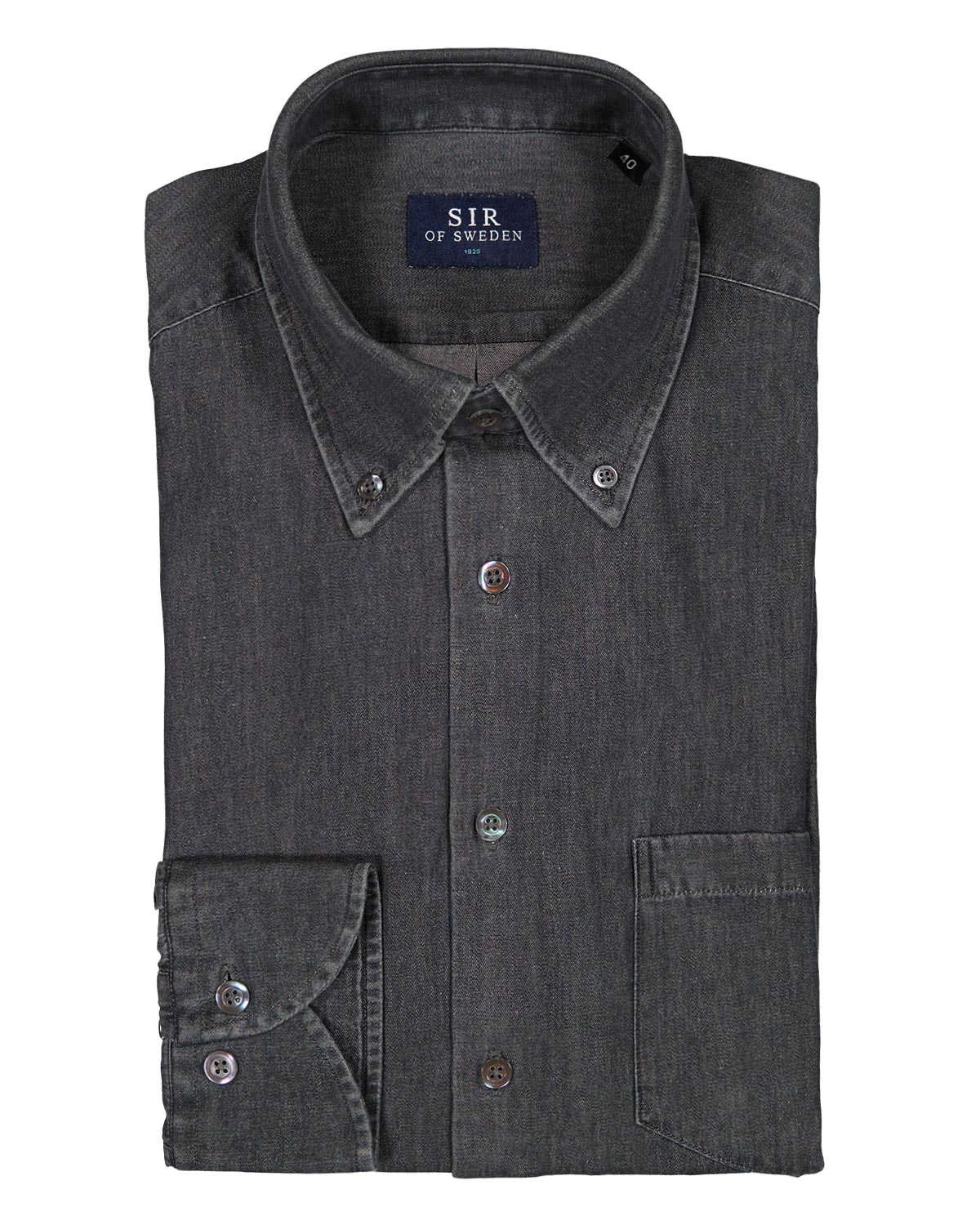 Folded dark denim shirt with button details on a white background