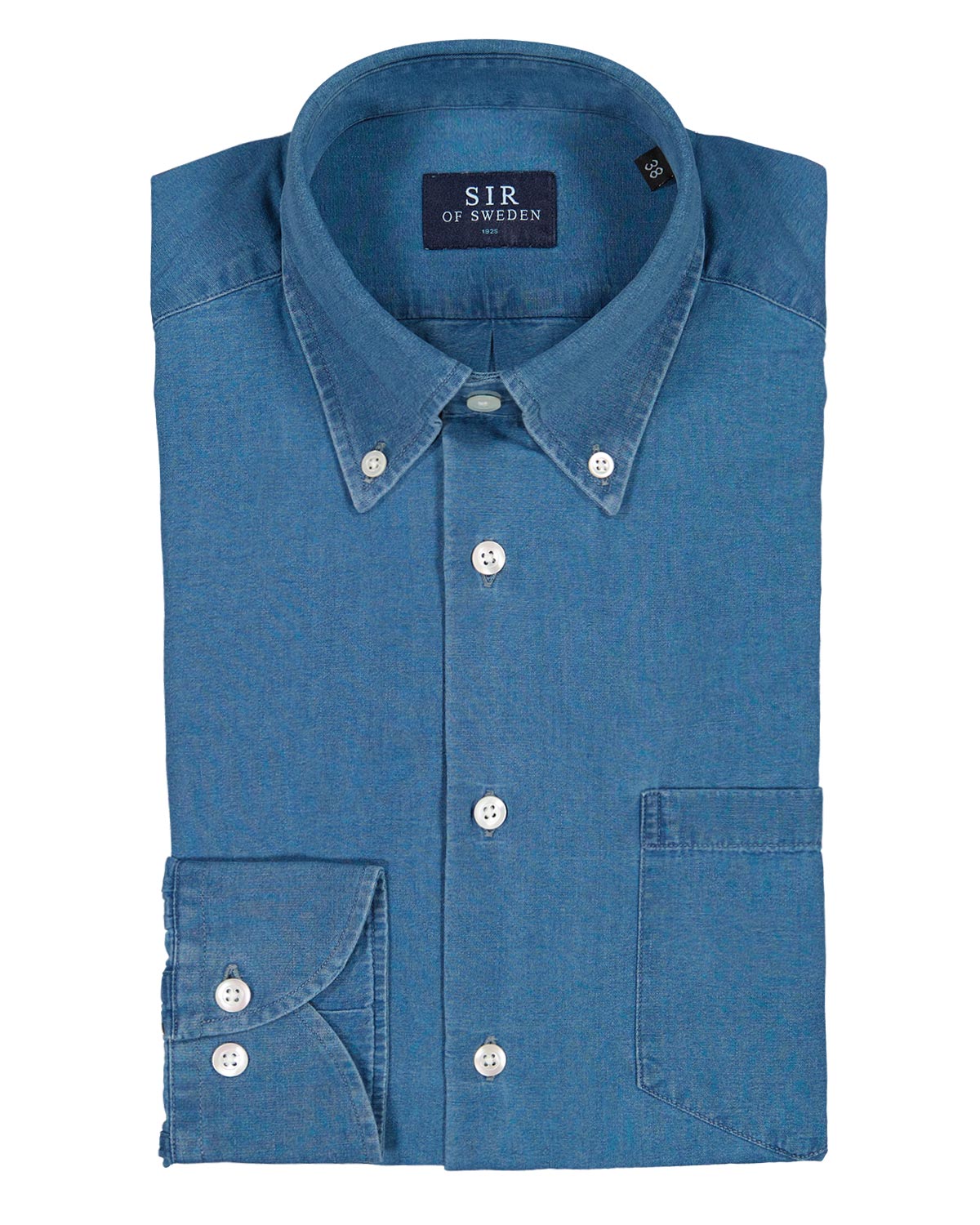 Folded blue denim shirt with 'SIR of Sweden' label on a white background